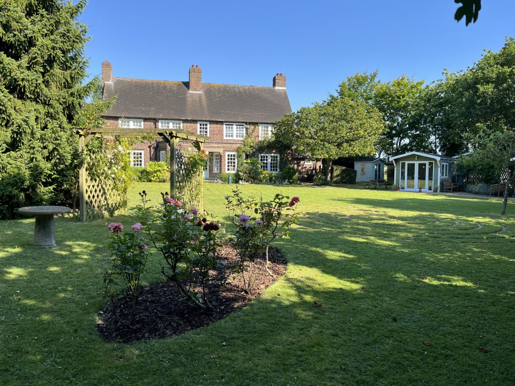 The Living Well Building and surrounding garden and retreat cabins